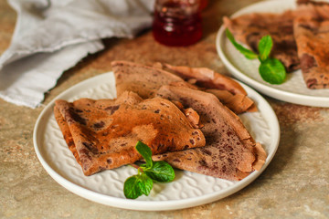 pancakes  chocolate (fritter with cocoa, delicious breakfast dessert) menu concept. food background. copy space. Top view