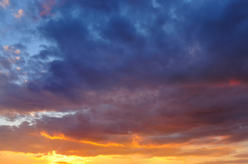 Naklejka na ściany i meble Colorful clouds in bright sunset.
