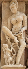 Sculptures on the walls of famous Khajuraho Temples in India. Khajuraho Temples are one of the...