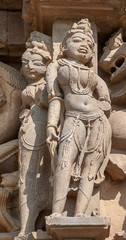 Sculptures on the walls of famous Khajuraho Temples in India. Khajuraho Temples are one of the...