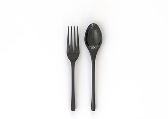 3D illustration of  black spoon, knife and fork on white background.