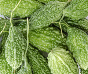 Fresh organic bitter gourd., one kind of herb and healthy food, closeup shot on white isolated.