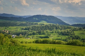 Beautiful spring green landscape. View of the charming villages in the mountains.