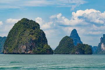 Naklejka premium Thailand. View Similan Islands. Clouds over sea. Rocky Islands in the Andaman sea. Journey. Phuket. The rocks are covered with vegetation. trip to Thailand.