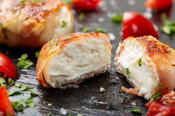 Fried goat cheese covered with smoked bacon