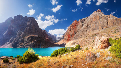 Fann mountains, Tajikistan. Turquoise water in Greater Allo lake in Fan mountains on clear summer...