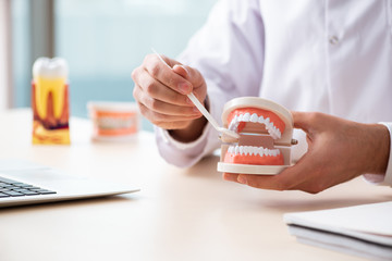 Fototapeta premium Male doctor stomatologist working in the clinic