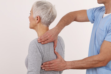 Back pain , Physiotherapy. Woman Chiropractic pain relief adjustment /Kinesiology treatment . Osteopathy practitioner