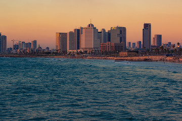 Fototapeta na wymiar Tel Aviv capital of Israel modern city beautiful evening sunset landscape and landmark skyscraper urban district view on Mediterranean sea beach waterfront 