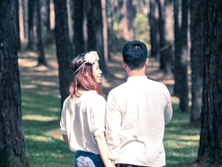 Women is happy in the pine forest