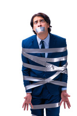 Tied employee with tape on mouth isolated on white