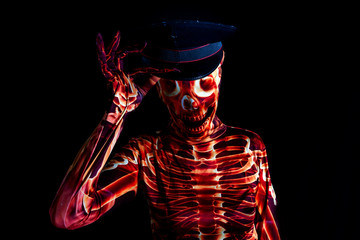 sensual woman dressed in a skeleton costume wearing a policeman's hat