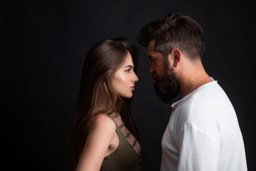 Secrets fantasy. Sensual touch. Sensual couple getting closer to feel each others lips. Passionate love. Romantic portrait of a sensual couple in love. Horny hot young lady embracing lover moaning.