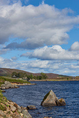 Looking towards the Reservoir pumping Station Building and the stone Walls of the ruin of Glenesk Parish Church, on Loch Lee in the Angus Glens.