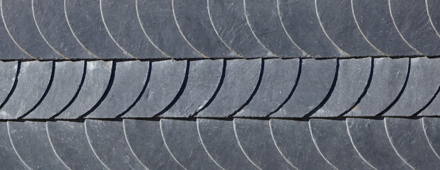 Aged slate roof tiles close-up