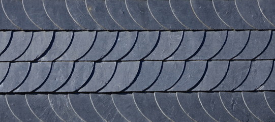 Aged slate roof tiles close-up