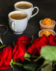coffee and roses bouquet, flowers (freshly brewed coffee white cup on the table) menu concept. food background. copy space. Top view