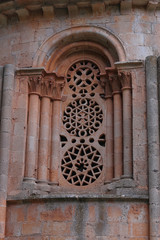 Romanesque window with semicircular arch and Mudejar root stone lattices. Hermitage of Santa Coloma, Albendiego (Guadalajara, Spain)
