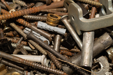 Screws background. heap of tapping screws. work tool. pile of fasteners. bolts and nuts. metal scrape