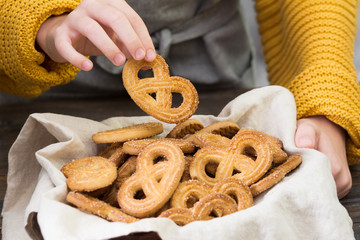 Cookies with sugar in the hands of a child