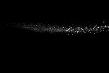 Obraz premium Freeze motion of white dust particles on black background.