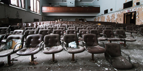 Chairs of the auditorium remains of an abandoned Detroit high school
