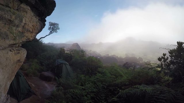 Tents on the top of Mount Roraima in Canaima national park  in Venezuela, in the midst of a moving cloud.