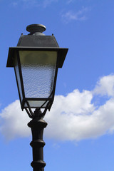 Fototapeta na wymiar street lamp and sky with clouds