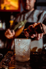process of preparing a cocktail bartender