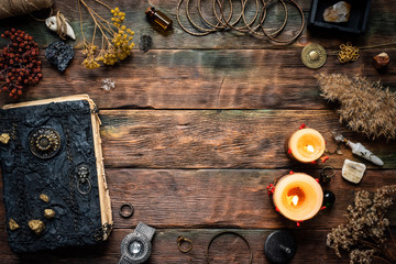 Magic recipe book and a magic potions on a table. Witchcraft background with copy space. Druid or...