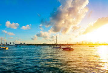 Miami Beach bayfront under a shining sun at sunset