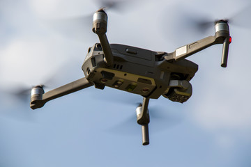 drone quad copter with high resolution digital camera on the sky