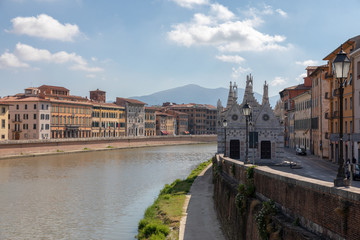 Fototapeta na wymiar Panoramic view on historic center of Pisa city and river Arno