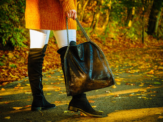 Woman wearing orange autumn cardigan outdoor