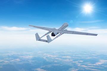 Unmanned aerial vehicle drone in flight gaining climbing altitude for the mission.
