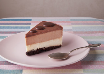 chocolate cake white and dark chocolate on a pink plate
