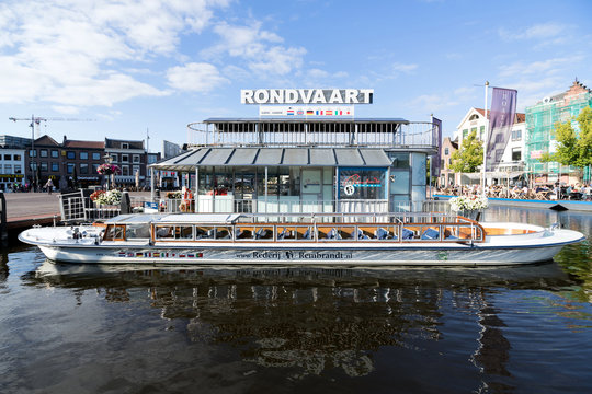 LEIDEN, THE NETHERLANDS - JULY 1, 2019: Canal boat SASKIA of Rederij Rembrandt at pier in the city center of Leiden.