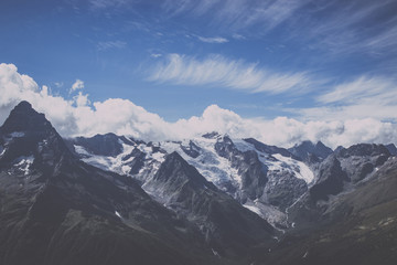 Fototapeta premium Panorama view of dramatic sky and mountains scene in national park Dombay