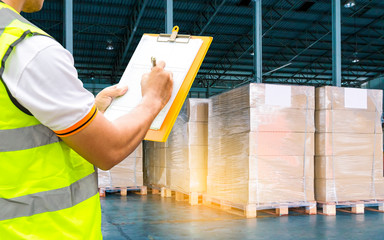 Workers Courier Holding Clipboard Doing Inventory Management The Products in Storage Warehouse....