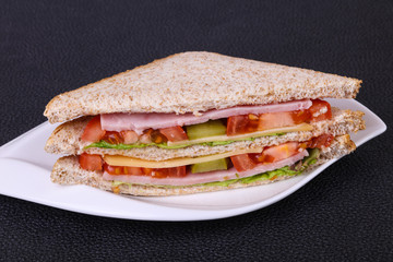 Club sandwich with ham and cheese