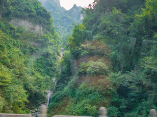 Beautiful view on the bus on tongtian road moving from tianmen mountain heaven gate cave on tianmen mountain national park at zhangjiajie city China.Tongtian Road the winding Road  99  curves road