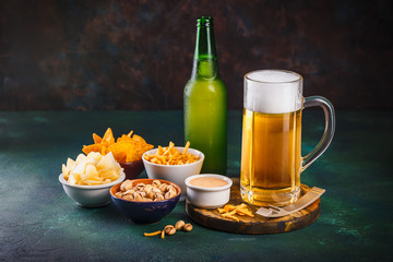Mug of beer on dark background