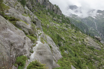Panorama of mountains on route of Trift Bridge in national park Switzerland