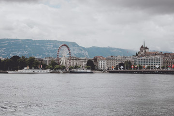 Fototapeta na wymiar View on Geneva lake, far away mountains and city Geneva, Switzerland