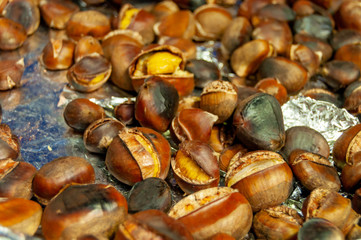 edible chestnuts on a metal tray