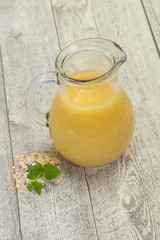 Dietary vegetarian oats milk over wooden