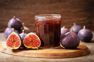 glass jar of figs jam with fresh fruits