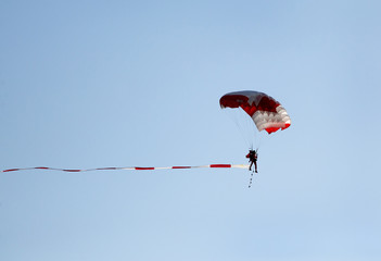 Parachute display team performs  during cricket festival at Isa Town, Bahrain
