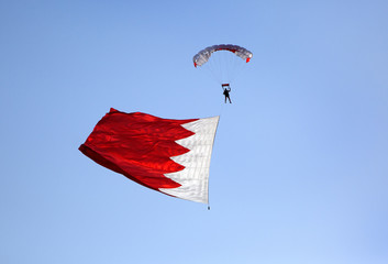 Parachute display team performs  during cricket festival at Isa Town, Bahrain