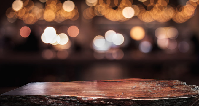 Wood texture table top (counter bar) with blur light gold bokeh in cafe,restaurant background